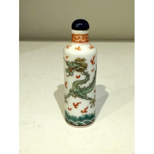 Porcelain enamel polychrome snuff bottle 
a dragon is looking for the burning pearl 
China 19th century    RESERVED
